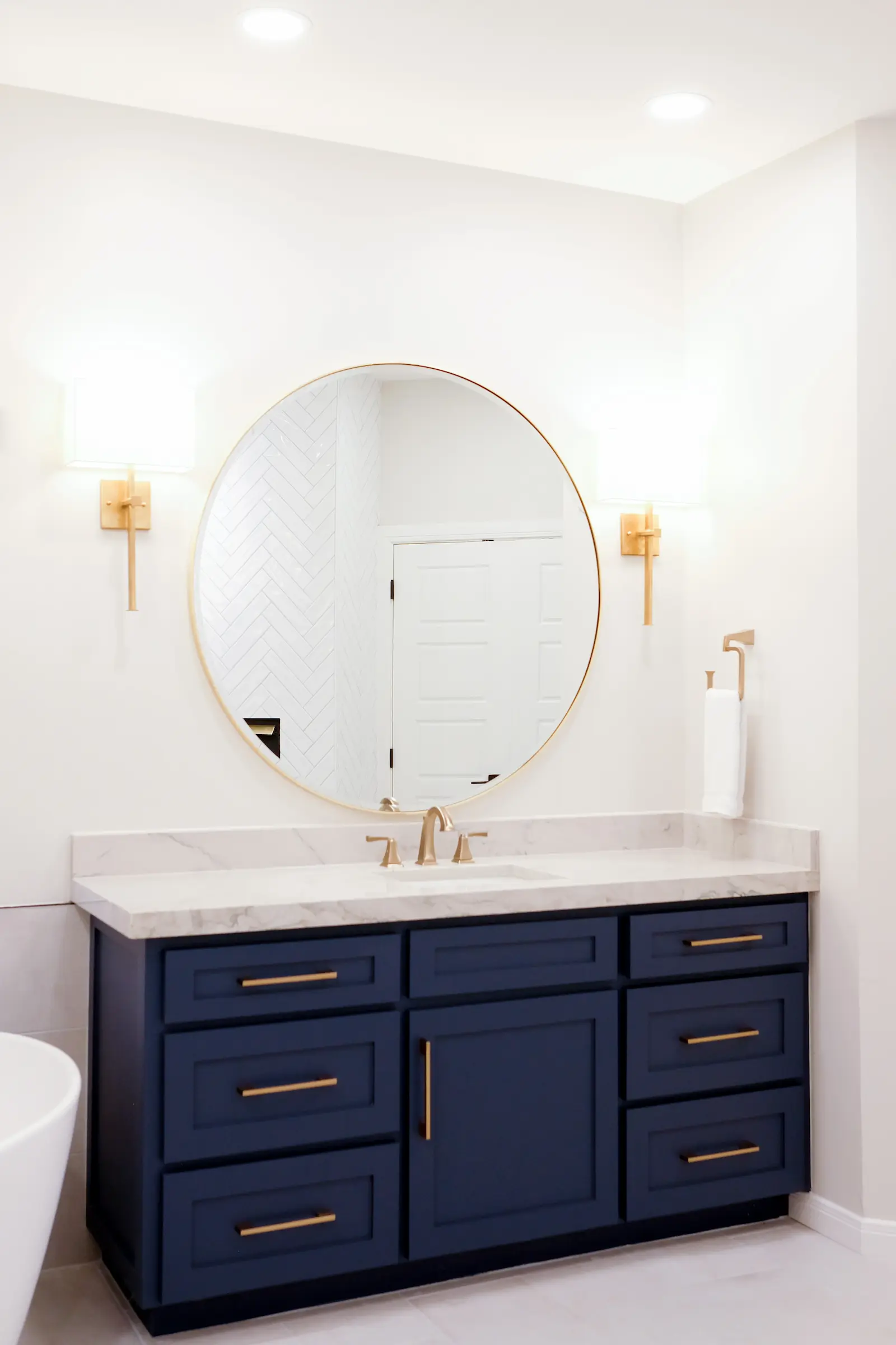 modern bathroom sink with circle mirror