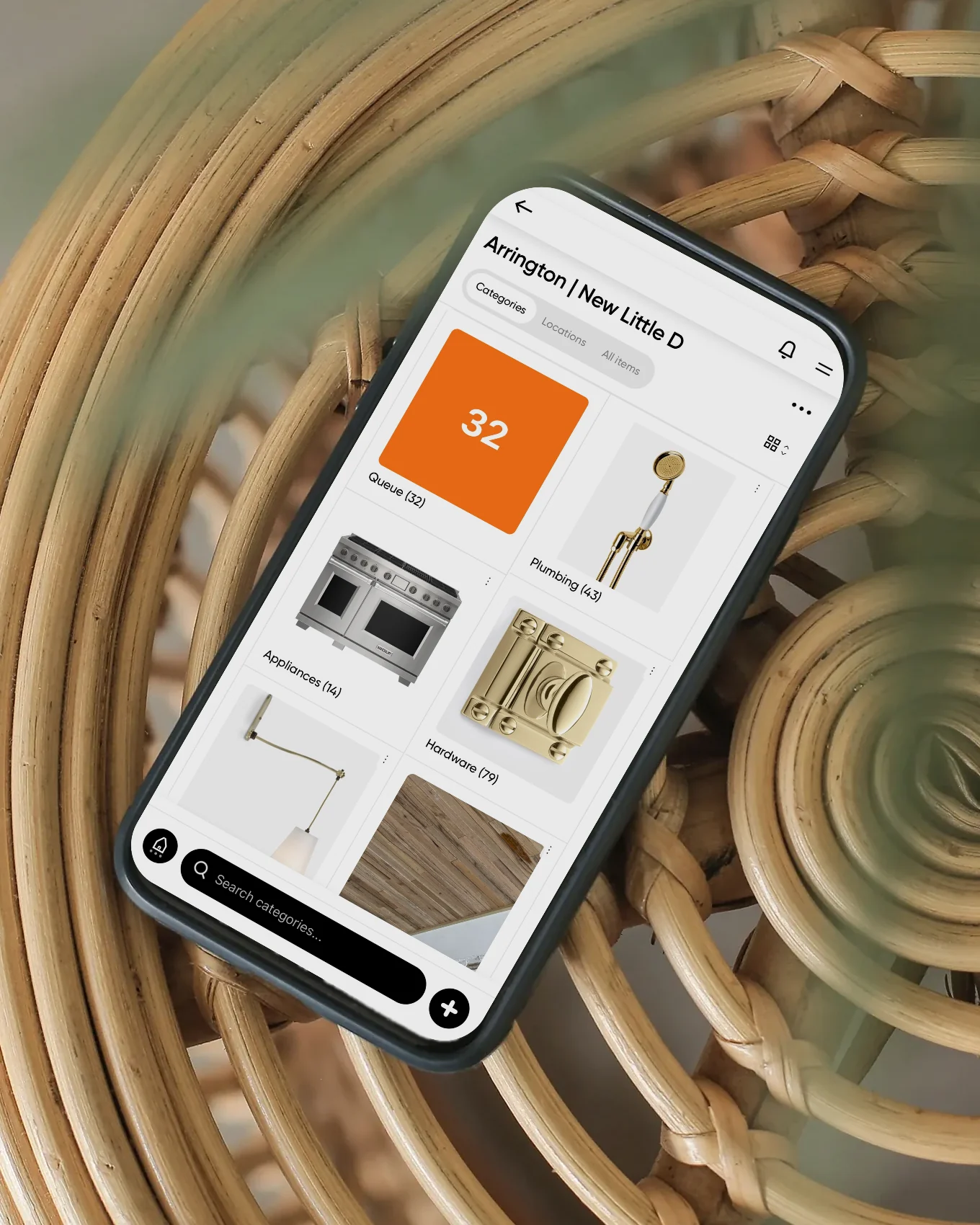 Phone on a rattan table showing a project in the Cosee Studio app